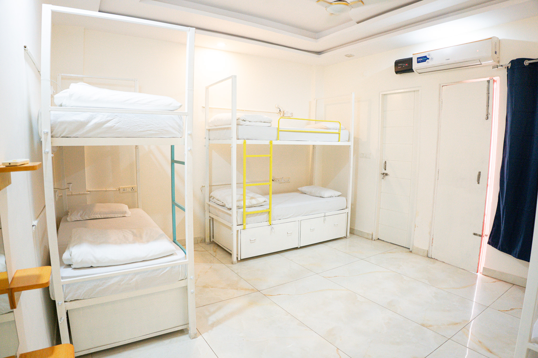Premium air-conditioned dorm with bunk beds at Trippme Rishikesh — 400 sq ft, sleeps 4-6 guests