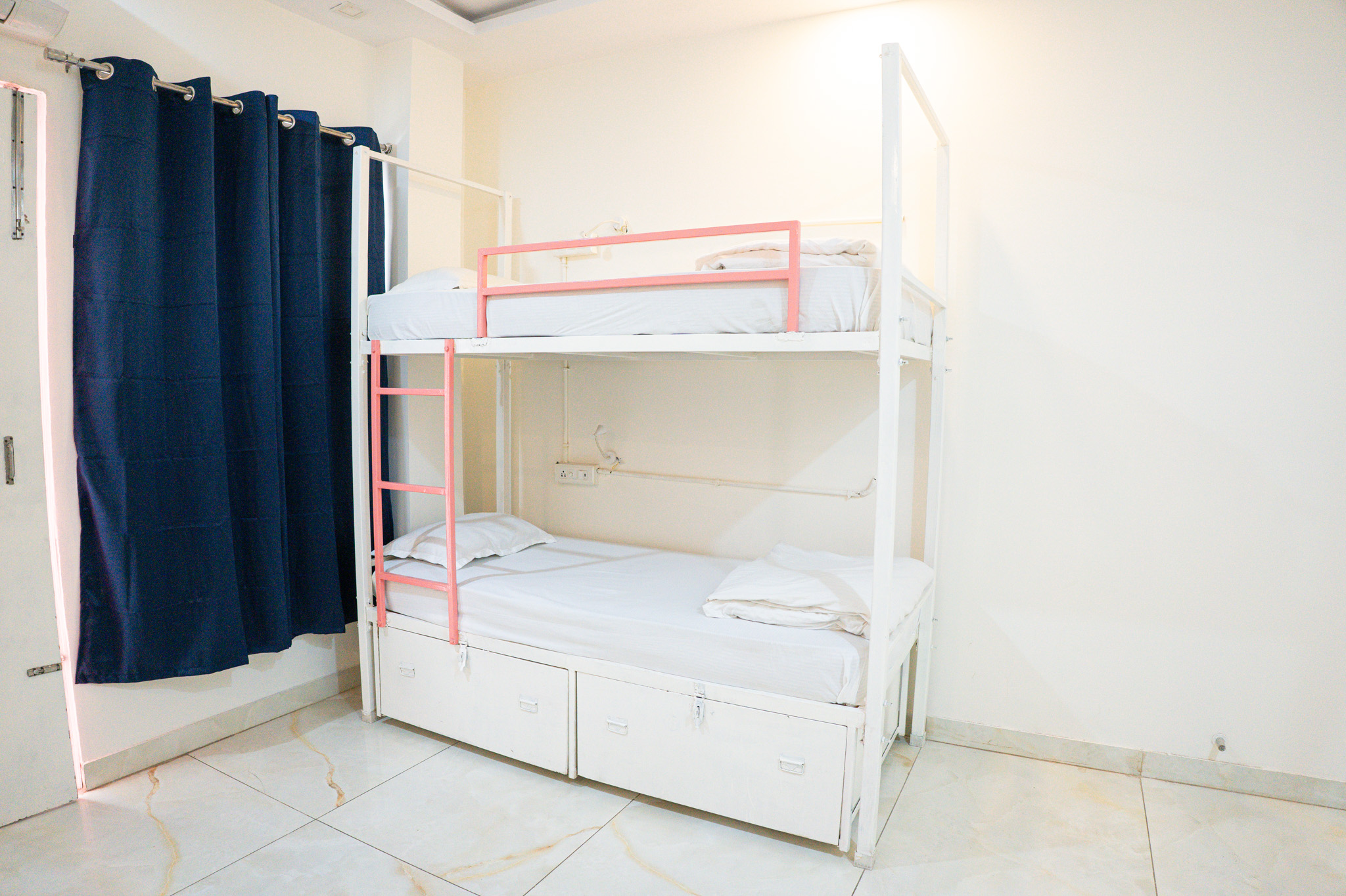 Premium air-conditioned dorm with bunk beds at Trippme Rishikesh — 400 sq ft, sleeps 4-6 guests