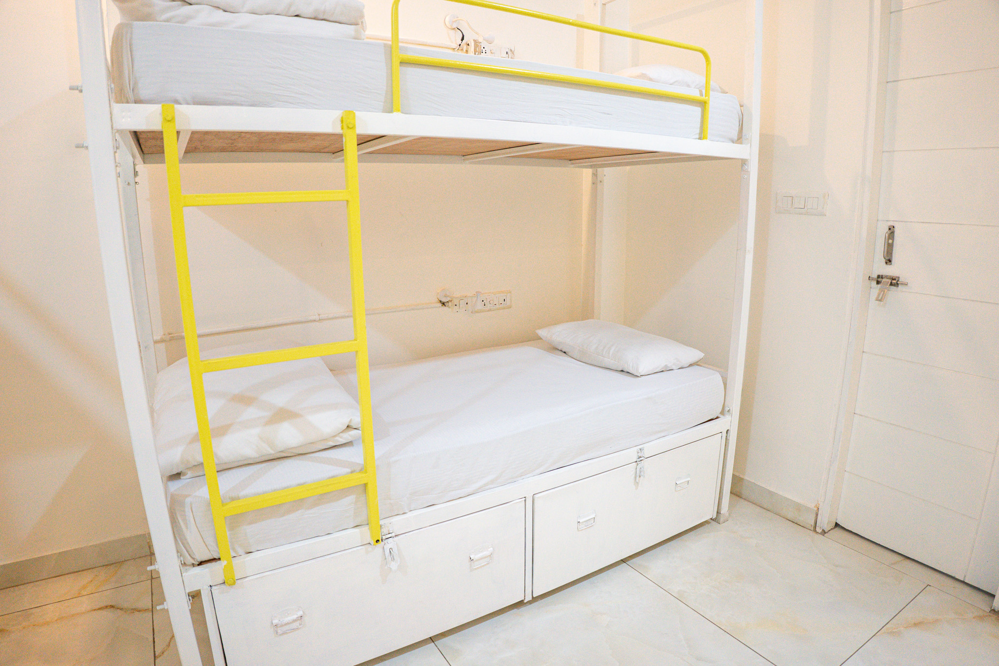 Premium air-conditioned dorm with bunk beds at Trippme Rishikesh — 400 sq ft, sleeps 4-6 guests